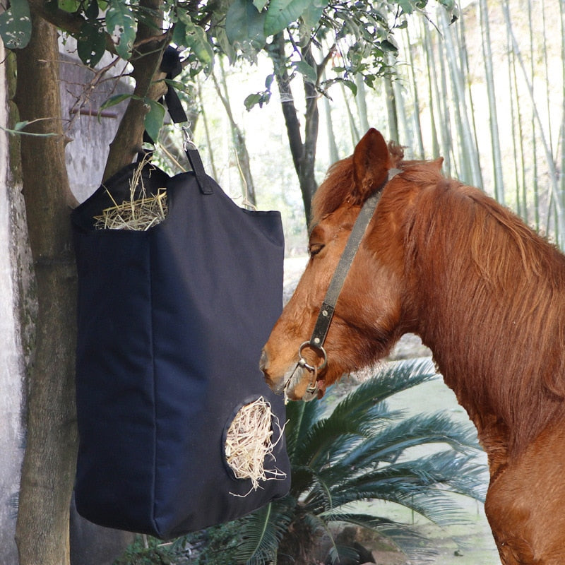 New Hay Bags Go Out To Feed Horses Slowly. Hay Bags Feed Horses. Big Bags In Stables Are Convenient for Horses.